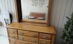wood 9 drawer dresser with detachable mirror. good shape other than a few wear and tear marks 60.00