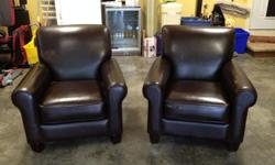 Two faux leather chairs, dark brown. One is in very good condition, the other one has some wear on one arm and front which apparently is repairable. Will only sell together. Very comfortable.
