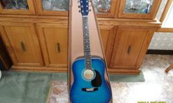 Acoustic Guitar
 
Excellent condition! 
Blue in colour. 
Packed in origainal 43" cardboard box. 
 Comes with book - "How To Play Guitar" 
 
Call: 807-887-3257 or email if interested.