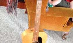 1980's acoustic guitar in good repair. Has a very mellow sound. $75 or best offer