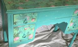 Vintage Chic solid wood desk , refinished in Anne Sloan Providence , and decoupage top and drawers . Lightly distressed . Sealed with polycrylic . 38W x 17D x 30H. Top drawer 32W x 3.25D , 2 Smaller drawers 7w x 7.25 D . Colour is most a curated in the