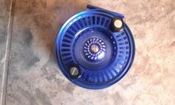 Blue Admundson Theron reel for sale used maybe twenty times one year old.