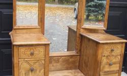 Beautiful antique dressing table in immaculate condition. Refinished to original stain/polish. Original hardware. Even the Insides of the drawers are finished and polished This is a unique piece, suitable for bedroom, hallway or guest room . We don't have