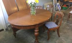 Antique walnut dining table, chairs and 3 leafs
Built in 1860's in Minneapolis and rebuilt and refinished 25 years ago.
Includes 5 ornate chairs and 3 extension leaves.
Price is firm.