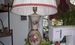 Antique lamp in excellent condition and working.   No chips, cracks, or pieces coming undone.