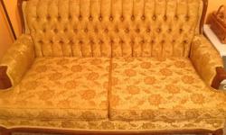 Antique gold love seat from the late 1960's. Wood detailing and queen Ann legs. Cushions are in great shape but it could use recovering as it has a rip on one seam and some damage on the sides from cat scratching (as shown in picture). Very clean from pet
