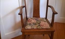 Solid, well-made antique oak dining chairs. One captain's chair with arms, five chairs without arms. Upholstered seats.