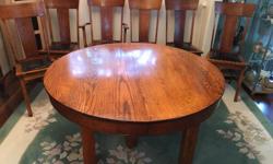 This is an immaculate set, c/w 5 dining room chairs, 1 Captain's chair and 5 leaves. There is a small chip in the Captain's chair, and 1 dining room chair seat needs re-upholstering. This set is 50+ years old.
The table is 48-inches in circumference, but