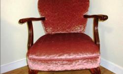 In excellent condition. Re-upholstered in the last 2 years. Beautiful wood arms and legs.