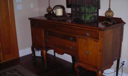 1928 oak sideboard from Hudson's Dept. Store in Detroit, Michigan. Purchased from grand daughter of first furniture dept. manager at Hudson's Dept. Store. Rich history with this piece. measures 65" l x 23.5" d x 38" h. has 1 59" drawer. 2 30" drawers and