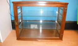 has two glass shelves, full door at back, has small damaged on trim just below door at right side along bottom ,dimentions for cabinet are hight-15"1/2, wide-9"1/2, length-18"1/2,coming from smoke free home, asking $200.00 or best offer.