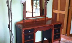 This lovely, detailed, antique vanity is at least 100 years old, I have refinished it. It is 31 inches high at table top, and 44 inches wide, and 52 inches high at mirror hight, stained and paint mix.