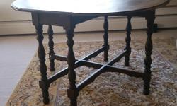 Antique Walnut Gate Leg Table
This antique walnut gate leg table is from the early 1900's.
It has been used as a dining room table, bridge table and sofa table.
The table measures 16" x 45" with leaves folded and 45" x 45" with leaves extended.
A very