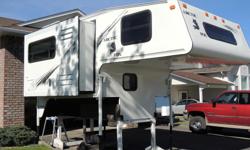 2001 Four Season 8'6 Arctic Fox with dinette/fridge slide.Sleeps four. 3-way Dometic fridge, Dometic microwave, oak cabinets, queen bed, Kenwood stereo, 3-burner stove with oven, furnace, bathroom, fantastic fan, 60lbs propane tanks, 40 gallon freshwater