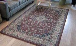 Area rug rusty brown with olive green and gold. Good shape. 93"x63".
