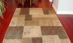 Beautiful thick quality area rug made in Eygpt.  5' X 8' .  Earthy tones and patch patterns. Bought less than a year ago for $400, in excellent condition, no stains, no smoking home, just doesn't go with decor in new house.  No calls after 9pm pls.