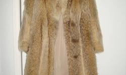 I have a full length 42 inch Artic Wolf fur coat for sale.  Excellent condition. Size 8-10 (roomy) could wear a sweater.  New lining put in. Wore the coat through winter then put in storage.  Asking price $800.00 o.b.o.