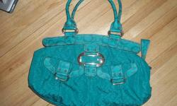 I am selling an authentic, medium sized, teal Guess purse that has been gently used. There are no stains or tears in it, it is in otherwise perfect condition. Will sell for $40.00.
2nd item- Beige medium sized authentic Guess purse, also in good