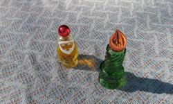Avon glassware, 4 pieces I am selling as a set.
 
Avon "CANDLE" perfume bottle (full) #14
  Green glass, orange top, 4 1/2 inches high.
Avon "SANTA" perfume bottle (full) #19
  Amber glass, red top, 3 1/2 inches high.
Avon "TURTLE" candle holder #25
