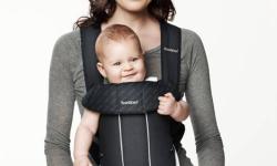 Ergonomic. Small and handy. This one really didn?t put any extra pressure on my shoulders or back, and my boy was BIG! Perfect condition, comes with slobber protector:-)
http://www.babybjorn.com/us/products/baby-carriers/baby-carrier-original/classic/