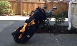 CAT golf bag with folding stand & multiple pockets in good condition. Complete with starter set of clubs.
