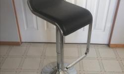 Bar Stool (chair) raises and lowers. Good shape except a small ripe on the top.
