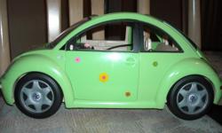 Barbie Volkswagon bug toy car, green, with flower decals. Made by Mattel in 2000. Doors and back trunk opens, has seat belts. Good condition, as shown in photos.