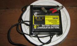 6 Amp Battery Charger with Automatic Overload Protection and Manual Shut Off. Use to charge all 12 Volt Batteries. Charge indicator shows charge rate LOW/MED/FULL. Includes 6' output cord. In Good Condition.