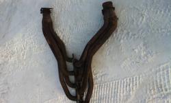Long tube headers.  Used for 1 year.  Nothing wrong with them.  Paid about $600 for them.  Gaskets come with.
(403) 581-8880