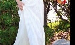 Beautiful BCBG Max Azria wedding dress worn once. Size 6, empire waist, flowing off-white crepe and fully lined.