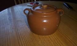 Excellent condition Brownish brown. Lid great bottom of it great. Call 250-679-7782