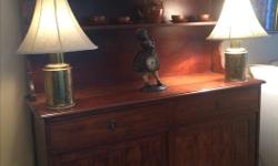 Rare piece of furniture using the rich Black African Walnut, the grain shines through very well. It has been lovingly maintained, having no blemishes or scratches.
It measures 62W, 21D, 72H
I comes in two pieces, the top shelving comes off.
This article