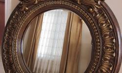 Absolutely Beautiful, One of a Kind, Large Baroque/ Ornate Round Mirror.
 
Antique Style, Exquisite Double Crown, LARGE Solid Wood, Intricately Carved, Beautifully Finished in Chestnut Brown, Carvings Highlighted in Antique Gold. EXCELLENT CONDITION.