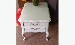 This antique side table has been given new life with a fresh coat of beach glass green paint. It has antique french provincial lines and a deep drawer for lots of storage. Could be used as a nightstand or side table
#coastal #frenchprovincial