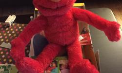 Sesame Street Big Hugs Elmo Plush Toy. New in box, only took out of box to photograph as was hard to capture picture in box.
Some features from the website:
-Sesame Street Big Hugs Elmo Plush Toy gives real hugs, moves his arms and plays songs, perfect
