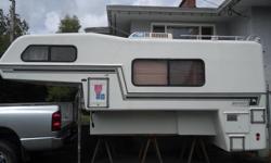 1990 11.5 foot bigfoot camper in decent condition, newer 120v/propane fridge/freezer, oven/stove, has fresh water and waste water holding tanks(not sure of size) and large awning. Recently replaced front jacks. All jacks work with no leaks, they are all