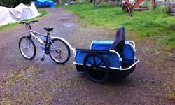Older mountain bike with lightweight trailer suitable to 200 lbs Good on trails .
Trailer has a detachable rain cover. Moulded plastic seat with removable washable fabric cover. Good for large kids.
Both bike and trailer in good condition.