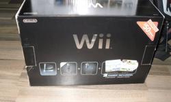 black nintendo wii console with 2 controls and 2 numchuks also has guitar hero game and guitar and wii fit board and game, also has wii sports resort and wii sports games.............not even a year old and played maybe 6 or 7 times....selling due to