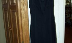 This is a gorgeous black dress from the designer label (BCBG). Two of the pictures show it much lighter than it is. It is very black. It suits any occasion and takes you there in style. Originally it cost over 100.00 so it is a steal at 15.00. It is made