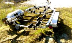 Northtrail dual axel trailer in good condition with the exception of rust on the axels and a little around the the frame. Previously held a 19.5 foot boat and has tail lights in working order. Rollers in good condition, trailer rated for 4000 lb. Asking