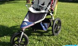 Navy blue BOB stroller in great condition. Comes with sheepskin insert, rain shield, handlebar console, snack tray AND car seat attachment bar. Rain shield and handlebar console have never been used and are in original packaging. Very smooth, front wheel