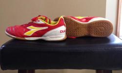 Diadora brand boys soccer shoes. Great shape. Flats. Size 5.5. Red/yellow colour