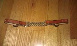 This is a Leather curb strap with double chain chinstrap, Brand new! Never used, I already have one for each of my horses so I don't need this one. I paid $10.00 plus tax for it. I'm selling it for $5.00
Please e-mail me.