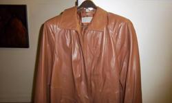 Brand new leather jacket, color as shown in pic. Size XL (1X). Never been worn, soft, buttery leather, made by a Canadian designer out of Montreal. Over the hip jacket with zipper front., side pockets. Email or call for further info.