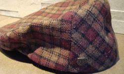 In excellent shape! Worn only twice! Burgandy and tan colored, plaid BRIXTON Poor Boy styled hat. Size 7 small 56cm