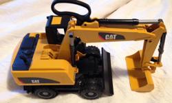 BRUDER Cat- Wheeled Excavator. Perfect condition. This was a gift which unfortunately did not get used.
Paid $100 at a specialty toy store. The price is firm. Thank you.
