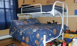 Single on top and double on bottom...metal frame...includes mattresses and some sheets.  Ladders on both sides.