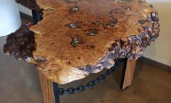 Birds eye burl table, the most amazing cut of Big Leaf Maple with excellent detail, live edge front with embedded hand picked rocks for colour and detail epoxied and ground flush, oiled and multiple layers of urethane. legs are choice cuts of spalted