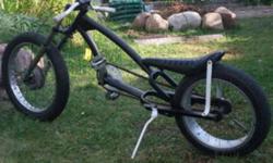 This bike is my PRIZE POSSESSION! Im 16 and built this myself just for something to ride around the neighborhood and gets a ton of attention!
 
Front wheel and fork assembly is from a yamaha rs100 motorcycle, the drum brake on the front also works. The