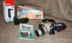 Canon Rebel 2000 Kit. Very good condition. Kit contains EOS Rebel 2000 camera body, zoom lens EF28-90mm F/4-5.6, wide strap and lithiumCR-2 battery. Also a Canon BP-200 battery pack. The above items are complete with their instruction manuals